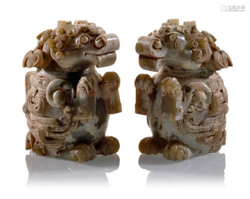 A PAIR OF CARVED JADE LIONS