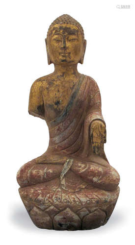 A STONE FIGURE OF BUDDHA WITH REMNANTS OF PAINTING