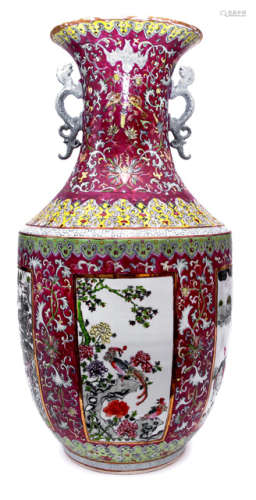 A LARGE FAMILLE ROSE VASE DEPICTING RESERVES ON BURGUNDIAN GROUND WITH LOTUS TWINES