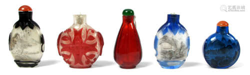 A GROUP OF FIVE GLASS SNUFF BOTTLES DECORATED IN VARIOUS WAYS INCLUDING SINGLE COLOURED OVERLAY AND INSIDE PAINTING