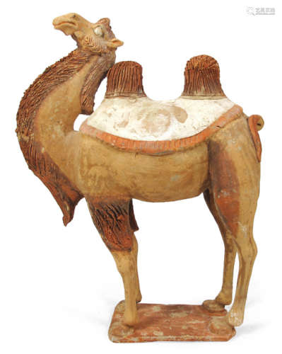 A PAINTED POTTERY FIGURE OF A CAMEL