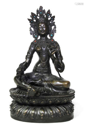 A BRONZE FIGURE OF GREEN TARA