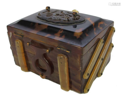 A TORTOISE SHELL BOX WITH CARVED DRAGON