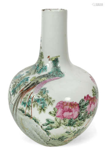 A POLYCHROME DECORATED PORCELAIN VASE DEPICTING A BIRD ON A ROCK