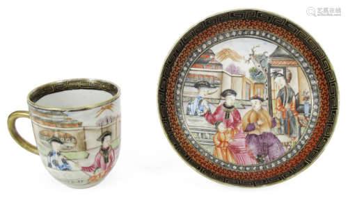 A POLYCHROME DECORATED PORCELAIN CUP AND SAUCER DEPICTING A FIGURAL SCENE