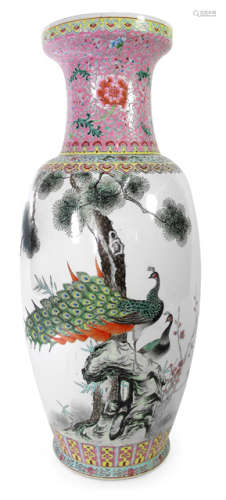 A POLYCHROME DECORATED PORCELAIN VASE DEPICTING THE THREE FRIENDS OF WINTER AND TWO PEACOCKS ON A ROCK