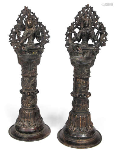 A PAIR OF BRONZE ALTAR CANDLE HOLDERS
