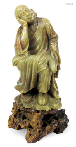 A SOAPSTONE CARVING OF SEATED LUOHAN