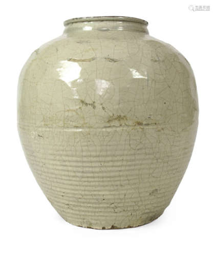 A CREME COLOURED AND CRACKLE GLAZED EARTHENWARE VESSEL