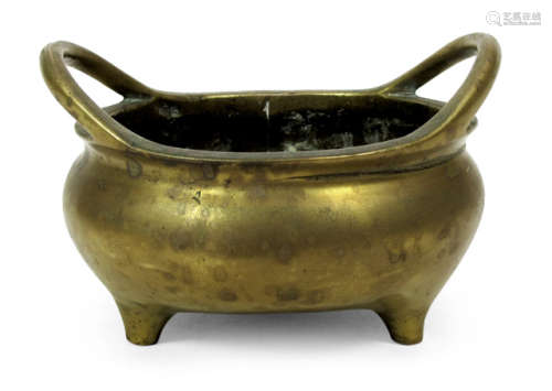 A BRONZE CENSER WITH TWO HANDLES AND INSCRIPTION TO THE BOTTOM