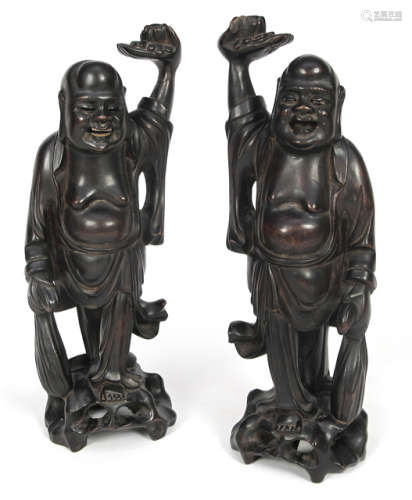 TWO HARDWOOD FIGURES OF STANDING BUDAI WEARING A SACK AND A LOTUS
