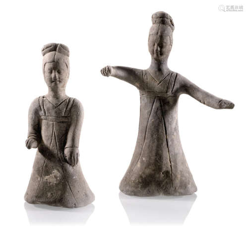 A POTTERY FIGURE OF A DANCING LADY AND A KNEELING FEMALE MUSICIAN