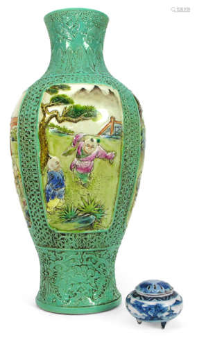 A POLYCHROME DECORATED PORCELAIN VASE DEPICTING PLAYING BOYS ON GREEN GROUND AND A BOX AND COVER