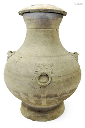 A CLAY URN AND COVER WITH FOUR HANDLES AND ENGRAVED COVER