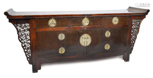 A LARGE CARVED SIDEBOARD WITH BRASS MOUNTINGS