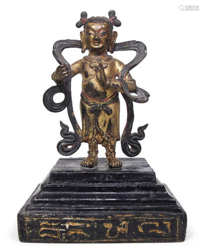 A GILT-BRONZE FIGURE OF AN ADORANT