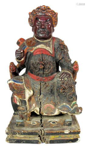 A PAINTED WOOD FIGURE OF A SEATED OFFICIAL