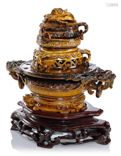 A THREE-PART CARVED TIGER EYE STONE CENSER ON WOOD STAND