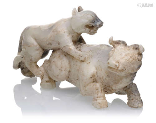 A JADE CARVING OF A LEOPARD ATTACKING A BUFFALO