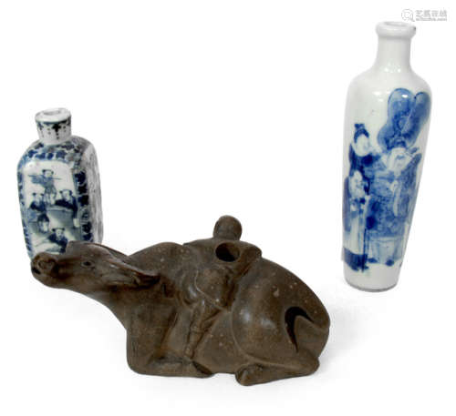 TWO UNDERGLAZE BLUE AND WHITE PORCELAIN SNUFF BOTTLES AND ONE IN THE SHAPE OF A RECUMBENT WATER BUFFALO
