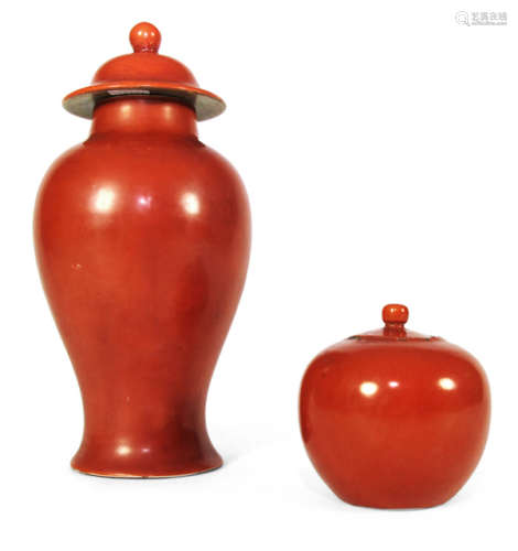 AN IRON RED PORCELAIN BOX AND COVER AND VASE AND COVER