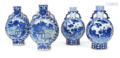 FOUR BLUE AND WHITE DECORATED PORCELAIN MOON FLASKS