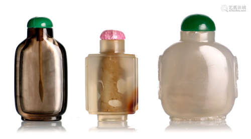 TWO AGATE SNUFF BOTTLES AND A SMOKY QUARTZ SNUFF BOTTLES