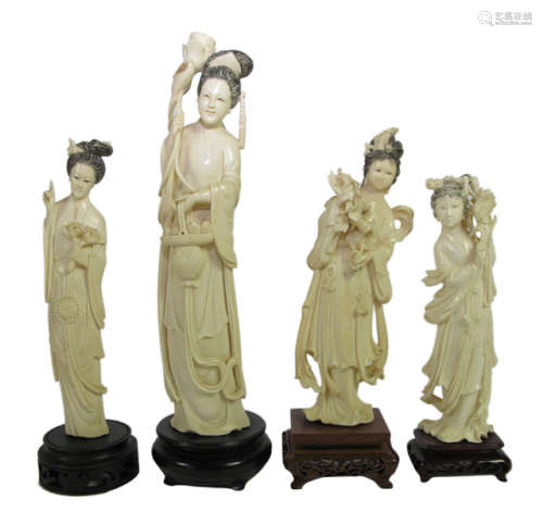 FOUR FINELY CARVED IVORY FIGURES ON WOOD STAND