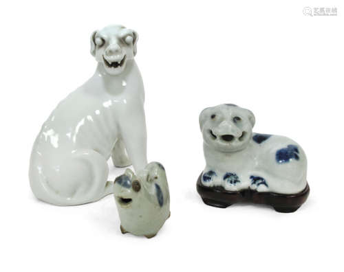 TWO BLUE AND WHITE AND ONE WHITE GLAZED PORCELAIN ANIMALS