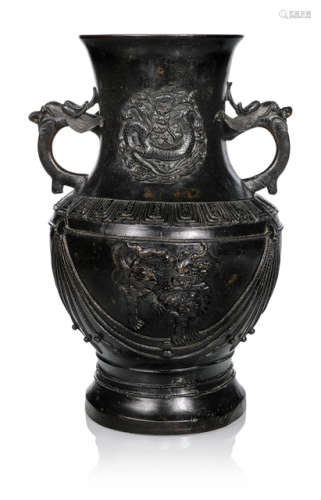 A BRONZE HU-SHAPED VASE WITH DRAGON MEDALLIONS