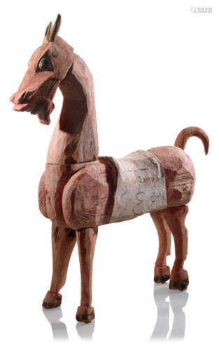 A PAINTED WOODEN FIGURE OF A HORSE