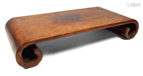 A LOW HARDWOOD TABLE WITH FEW SILVER INLAYS