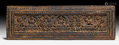 A CARVED WOODEN SUTRA BOX SHOWING MANJUSHRI, SHADAKSARI AND CANDA-VAJRAPANI. Tibet, 14th c. 14x42.5 cm. Minor chips.
