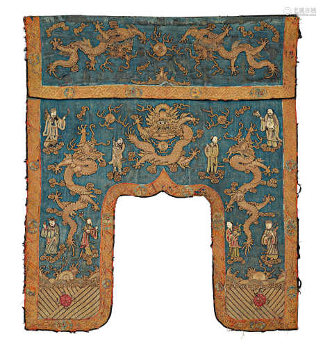 A BLUE SILK ALTAR DRAPE WITH GOLD EMBROIDERY OF FIVE-CLAWED DRAGONS AND THE EIGHT DAOIST IMMORTALS OVER THE UR-OCEAN. China, Qing Dynasty, L 107 cm, W 39 cm. Somewhat damaged and restored.