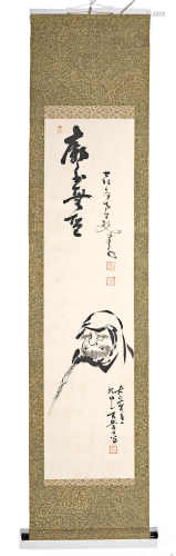 A KAKEMONO BY NAKAHARA NANTENBO (1839-1925) OF A DARUMA AND A CALLIGRAPHY.