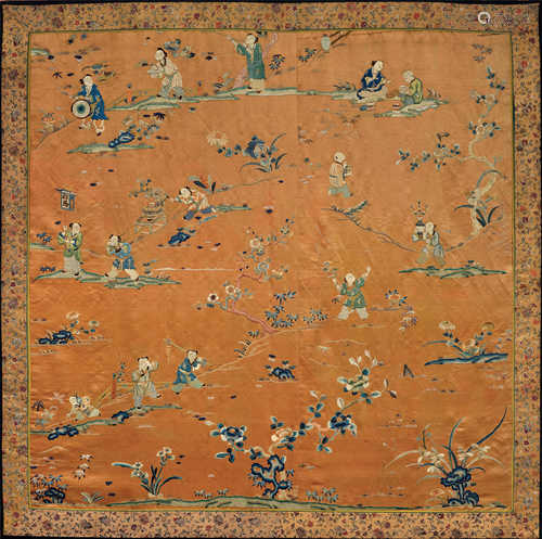 A SILK EMBROIDERY SHOWING PLAYING KIDS IN A GARDEN SETTING.