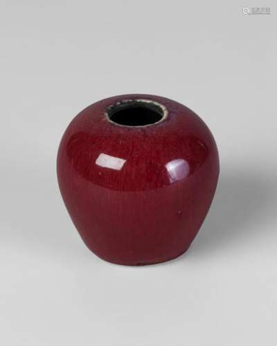 A Chinese grey stonware flambe water pot, 18th century, of globular form, the narrow mouth with purple glaze fading to rich cherry-red, unglazed base, 5.5cm high