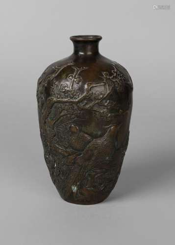 A Japanese bronze ovoid vase, Chinese Xuande mark but 19th century, applied to the body with birds amidst prunus and chrysanthemum blossom, inscribed with poem to reverse, 19.5cm high