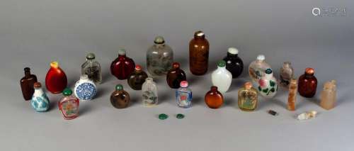 Twenty-two Chinese snuff bottles, late Qing - Republic, to include inside painted glass examples, two cameo glass bottles, agate, and wood, an agate seal and a hardstone cigarette holder (24)