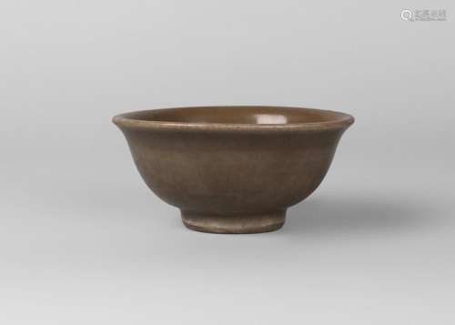 A Chinese Longquan celadon bowl, Yuan dynasty, 14th century, with thick celadon glaze over grey stoneware body, decorated to the centre with a lotus flower, unglazed, red-burnished base, 14cm diameter, 6cm high