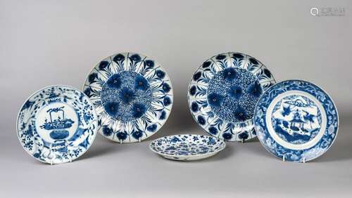 A pair of Chinese export porcelain bowls, Kangxi period, each painted in underglaze blue with chrysanthemum, both with underglaze blue double ring marks, one with Artemisia leaf, 27cm diameter, and three 18th century export porcelain blue and white dishes, 22cm diameter (5)