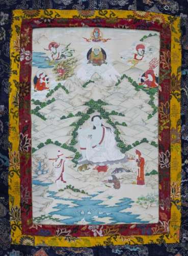 A Tibetan thangka, 20th century, painted with a seated deity, within an extensive mountain landscape, with six deities above, 74cm x 46cm, within a silk border