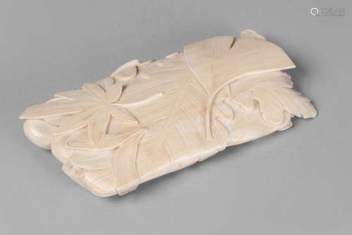 A Japanese ivory 'leaf' dish, late 19th/early 20th century, carved as leaves and mushrooms, 12cm x 6cm