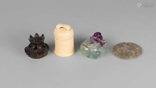 A Chinese pink and green quartz water pot, llate 19th century, 6cm long, a Ming bronze lotus pod censer lid, and carved green hardstone plaque, and an ivory bell-shaped box with seal inscription to base (4)