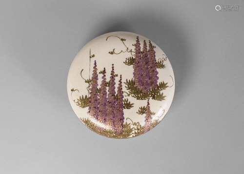 A Japanese Satsuma circular box and cover, Meiji period, painted to the cover with wisteria, and to the inside with chrysanthemum, 9.5cm diameter