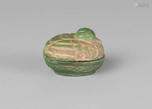 An Annamese grey stoneware seal paste box and cover, early 19th century, green glazed and modelled as a duck, 6cm long, 4cm high