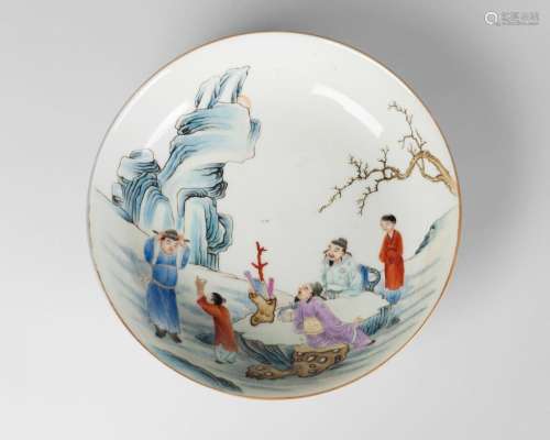 A Chinese porcelain saucer dish, Guangxu mark, Republic period, painted in famille rose enamels with two scholars and three children, with pale turquoise glaze to underside, underglaze blue six-character mark to base, 18cm diameter