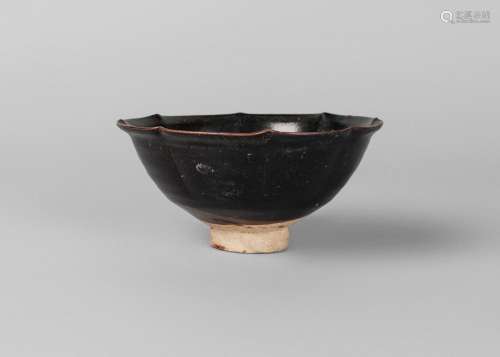 A Chinese black-ware 'lotus' bowl, Yuan dynasty, 13th century, with everted rim, and petal moulded sides, 14cm diameter, 7cm high