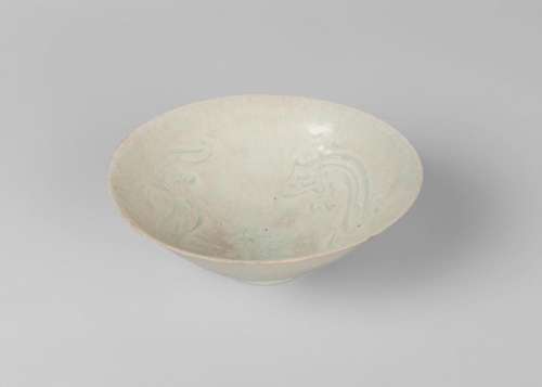 A Chinese qingbai 'dragon' bowl, Yuan dynasty, carved to the inside with two stylised chi-long dragons, unglazed recessed foot, 20cm diameter, 6.5cm high