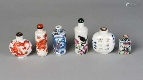 Six Chinese porcelain snuff bottles, late Qing dynasty, three painted in underglaze blue, one with applied decoration and painted in famille rose enamels, and two painted in iron red, one Daoguang mark and period, another marked for Yongzheng, 5cm - 9cm